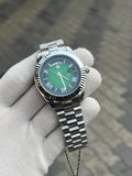 rolex.. Day Date Silver Green Roman Dial